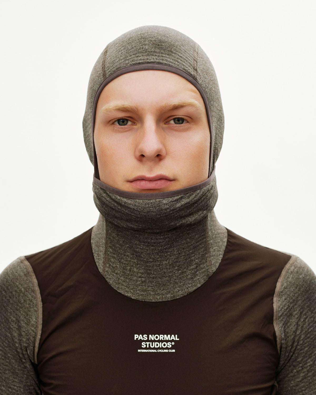 Dark Coffee brown Essential cycling balaclava on model, front view with contrast trim binding #Color_Dark Coffee