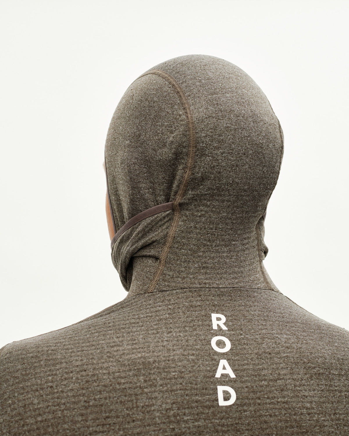 Dark Coffee brown cycling baselayer with hood, rear detail on model with white ROAD back print #Color_Dark Coffee
