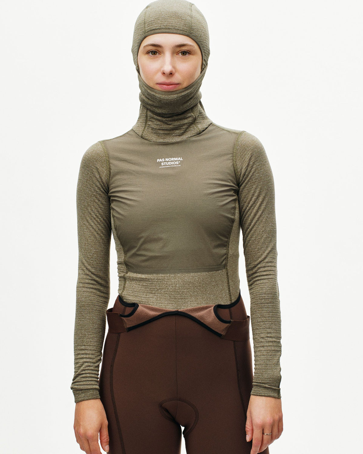Grey Thermal Hooded Windproof base layer on model with white chest logo and textured sleeves #Color_Dark Stone