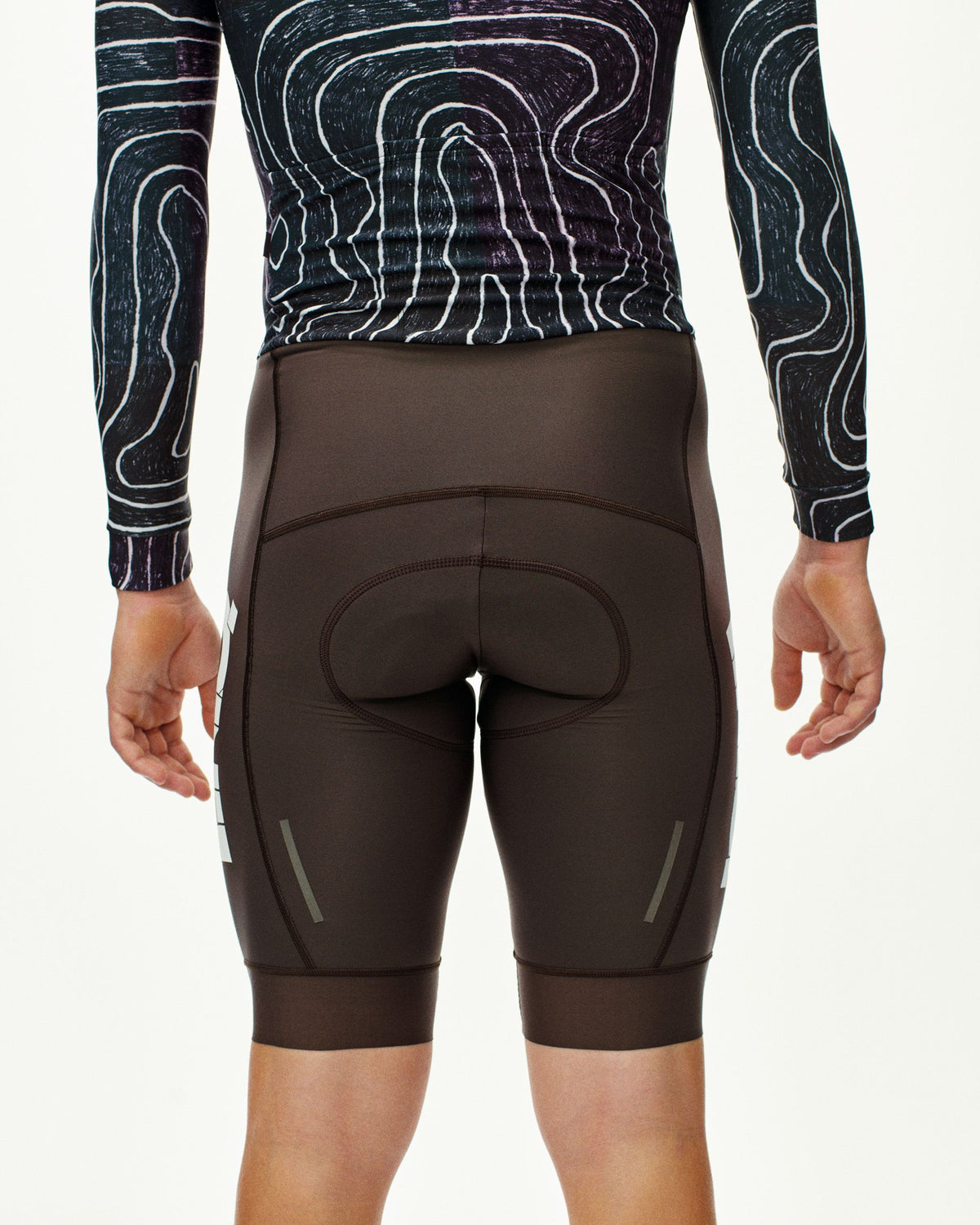 Black T.K.O. thermal speedsuit on model, rear view with side reflective details #Color_T.K.O. Black Multi