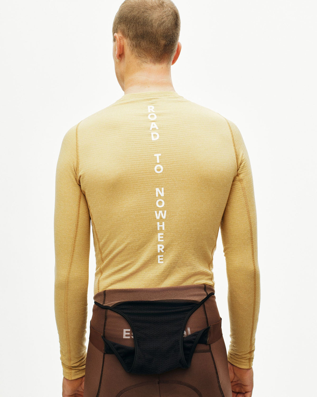 Camel Thermal Hooded Windproof base layer, rear view on model with white vertical spine text #Color_Camel