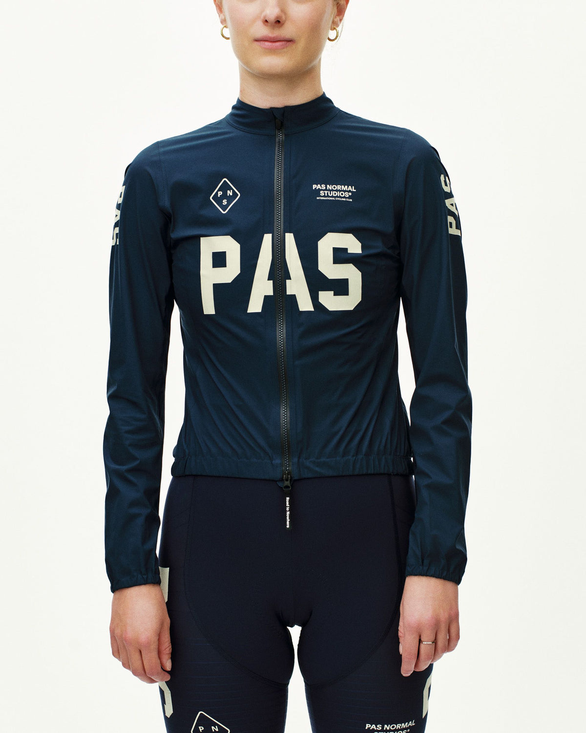 Navy PAS Mechanism Rain cycling jacket on model with large white chest print #Color_Navy