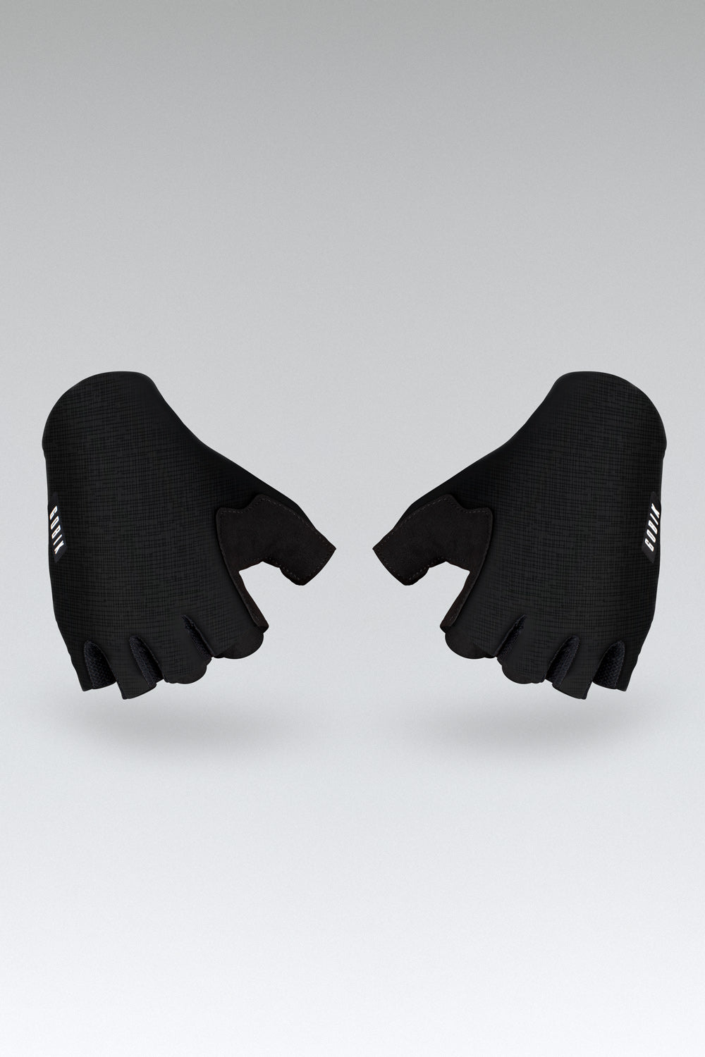 Guantes Gobik Mamba 2.0 en Black, bodegón del par visto desde arriba con los puños en primer plano #Color_Black