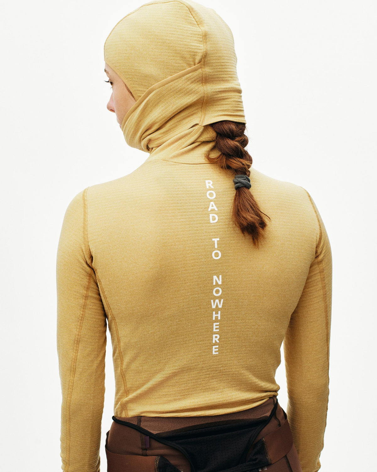 Camel thermal hooded windproof base layer on model, rear view with white vertical spine text #Color_Camel / Maroon