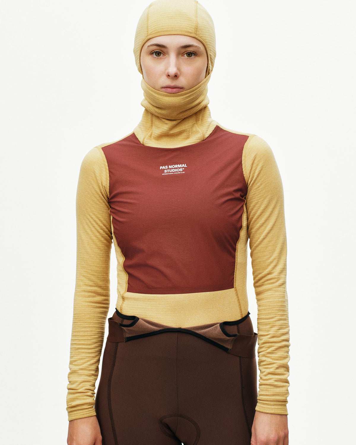Yellow Thermal Hooded Windproof base layer on model with maroon panel and white chest logo #Color_Camel / Maroon