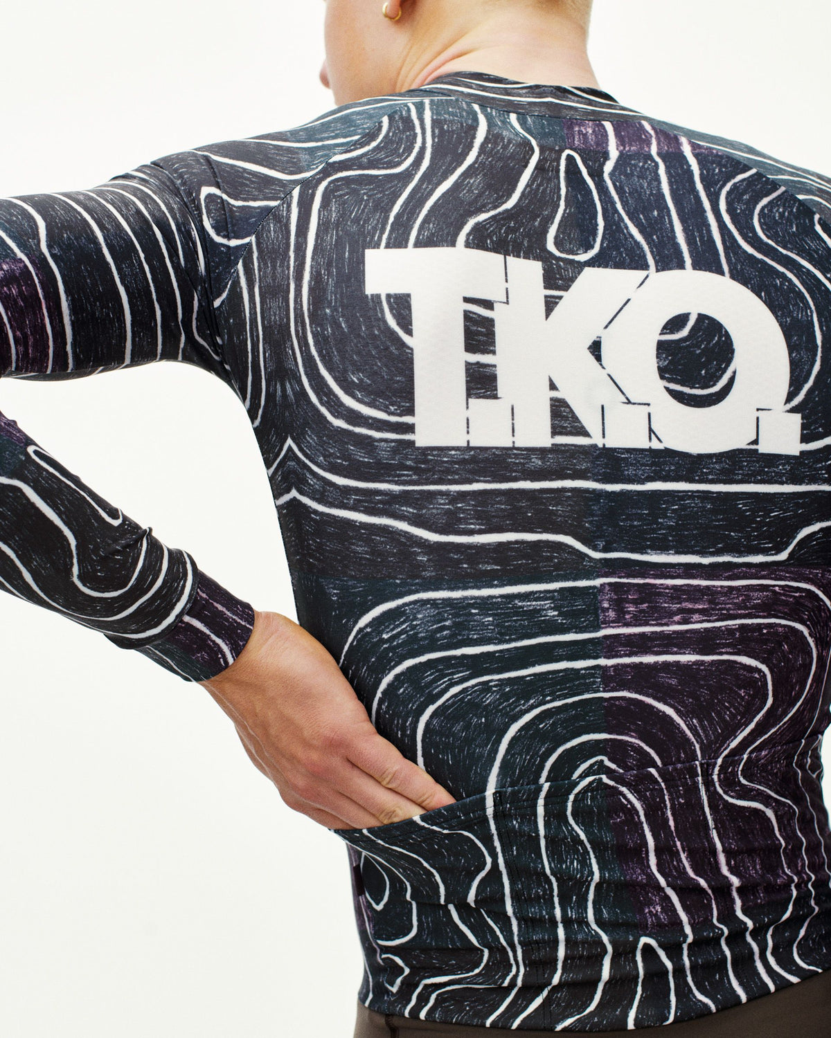 Black Multi T.K.O. thermal speedsuit on model, rear view with topographic allover print and white TKO back logo #Color_T.K.O. Black Multi