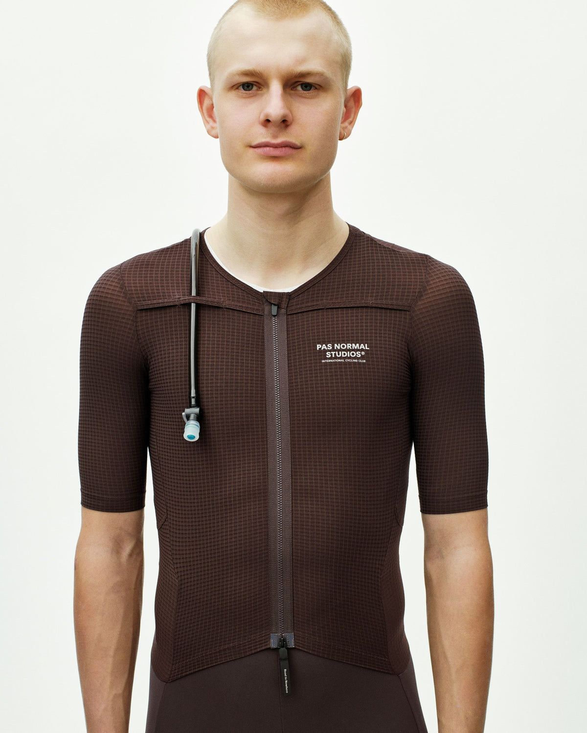 Dark Red Escapism speedsuit on model with textured fabric and full front zip #Color_Dark Red