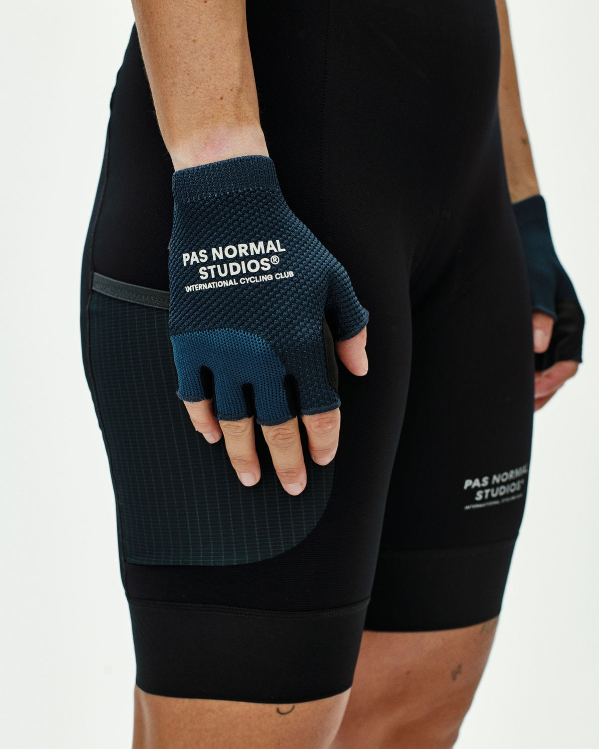 Navy Escapism cycling mitts on model showing fingerless design and textured palm grip #Color_Navy