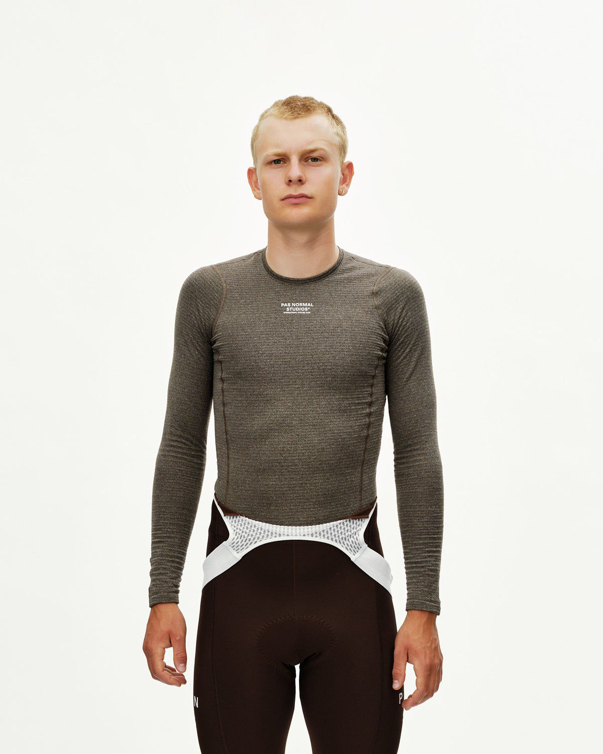 Dark Coffee brown Essential cycling long sleeve baselayer on model, front view with white chest logo #Color_Dark Coffee