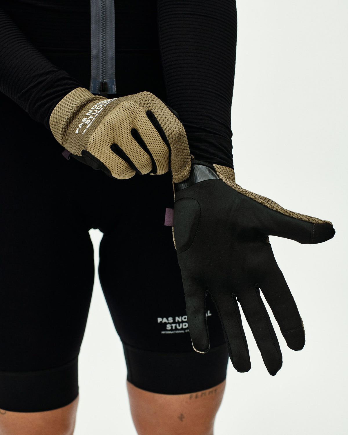Earth Escapism cycling gloves on model with textured palm grip and ribbed cuff #Color_Earth