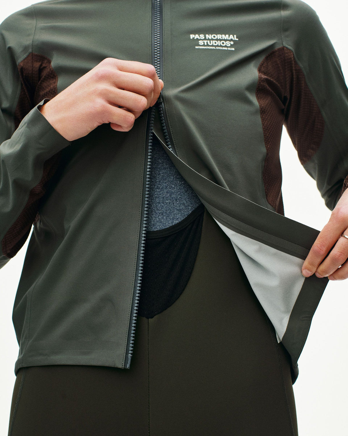 Dark Grey Mechanism Shell jacket on model with open front zip showing mesh panel interior #Color_Dark Grey