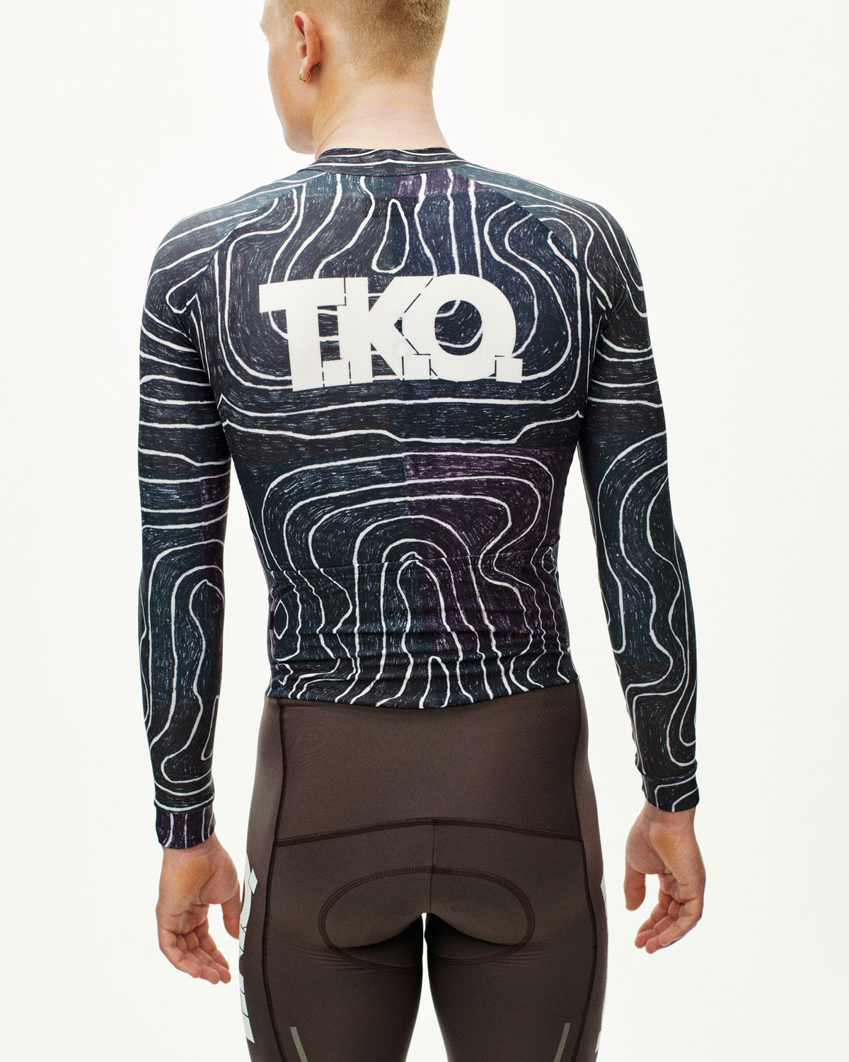 Black Multi T.K.O. Thermal Speedsuit on model, rear view with contour line allover print and white TKO back logo #Color_T.K.O. Black Multi