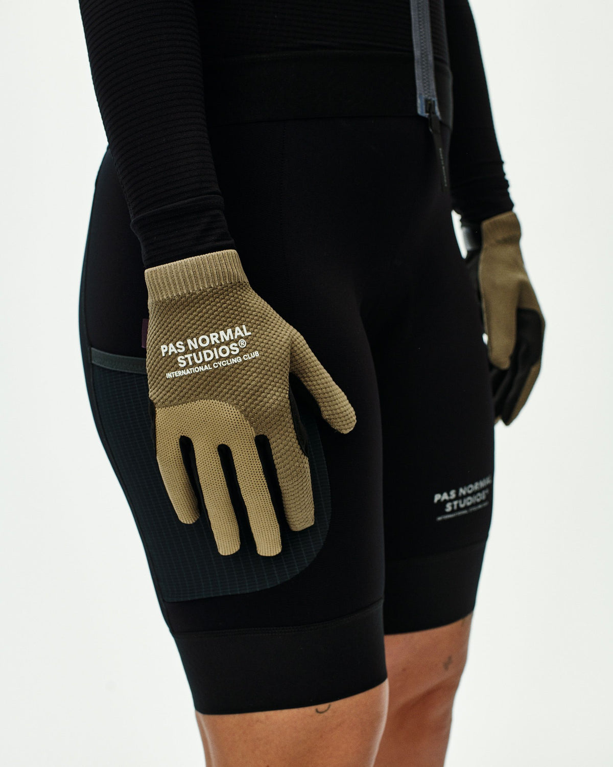Earth Escapism cycling gloves on model with textured palm grip #Color_Earth