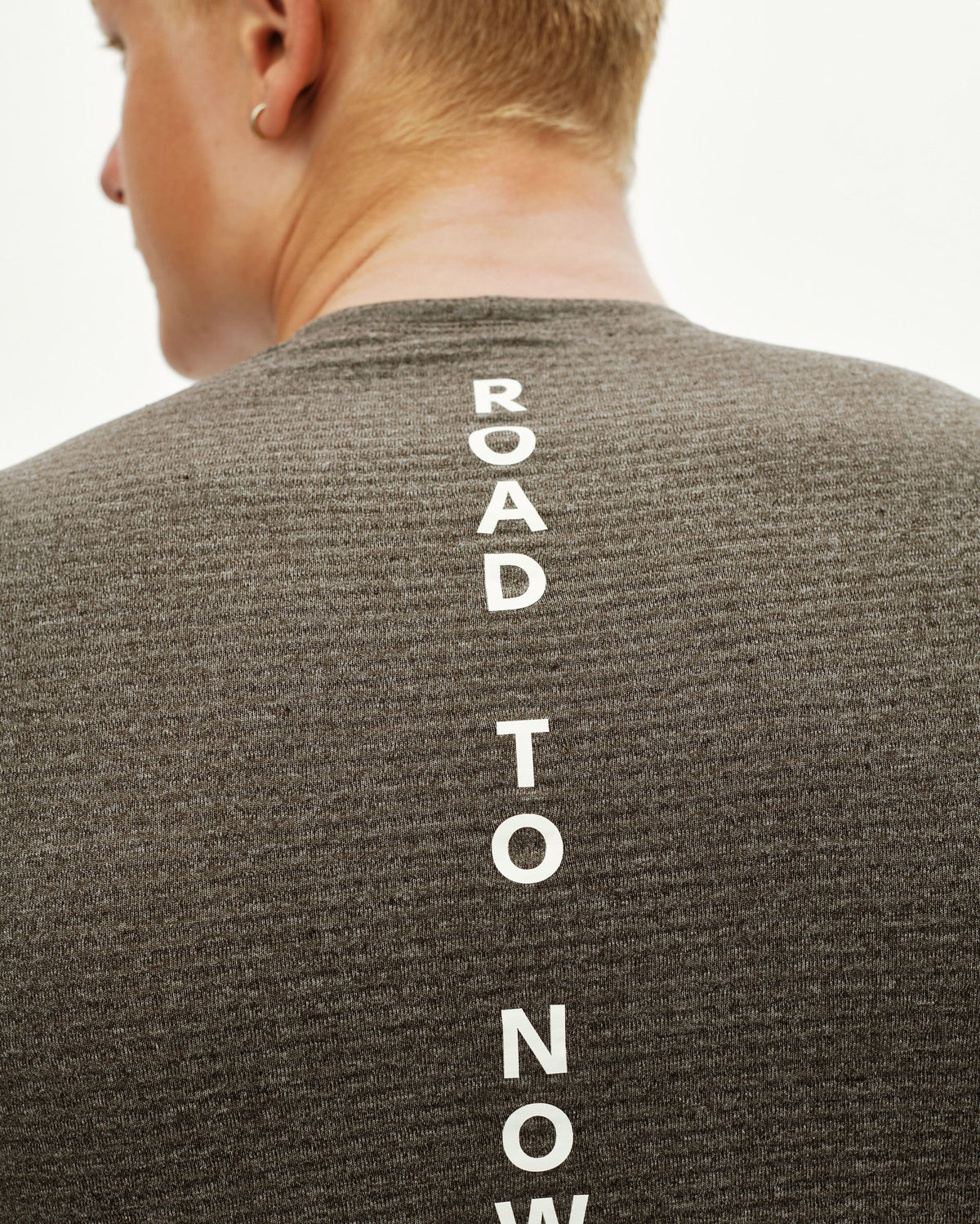 Dark Coffee brown Essential cycling base layer, rear detail on model with vertical white text print #Color_Dark Coffee