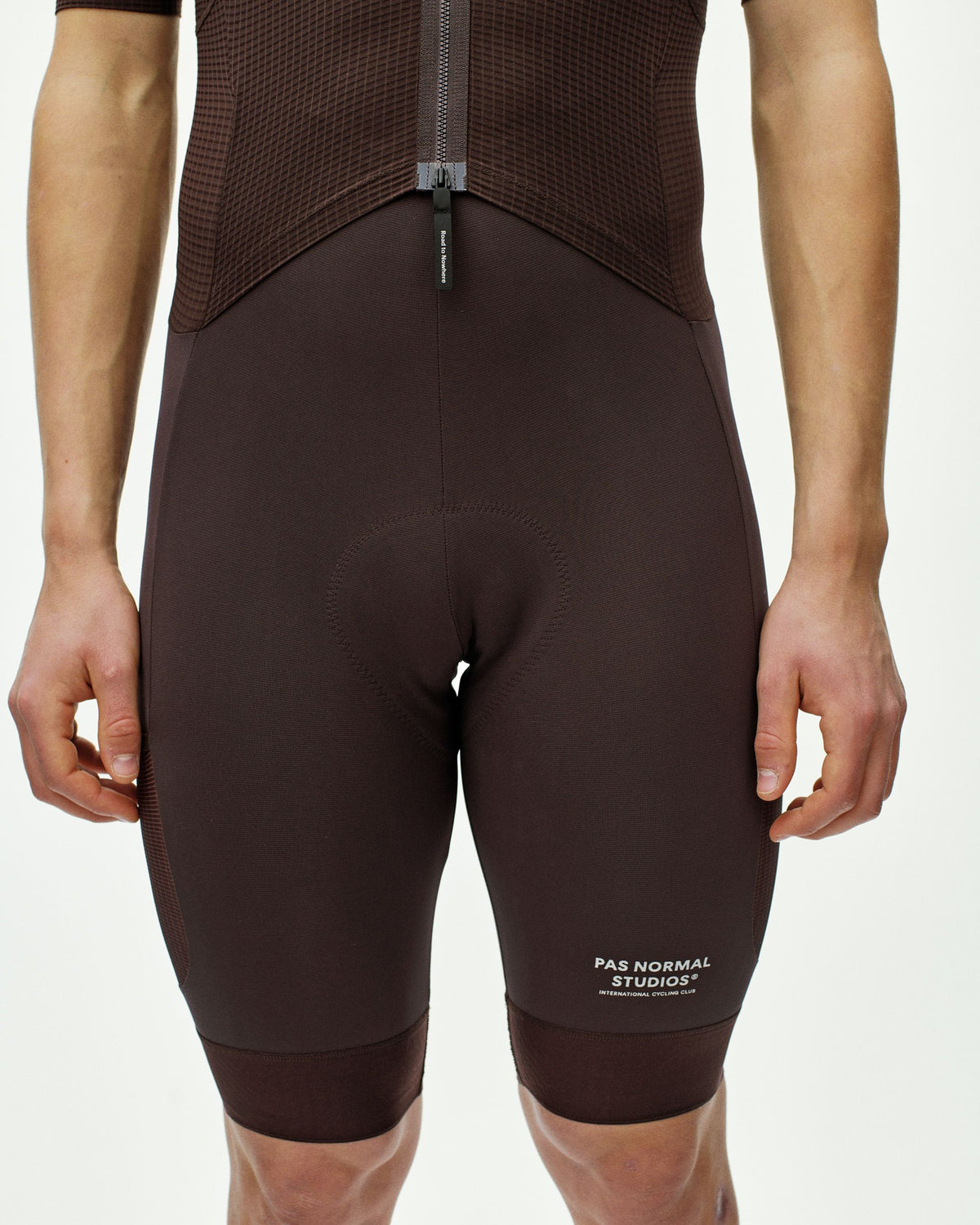 Dark Red Escapism speedsuit, rear view on model with contrast textured upper panel #Color_Dark Red