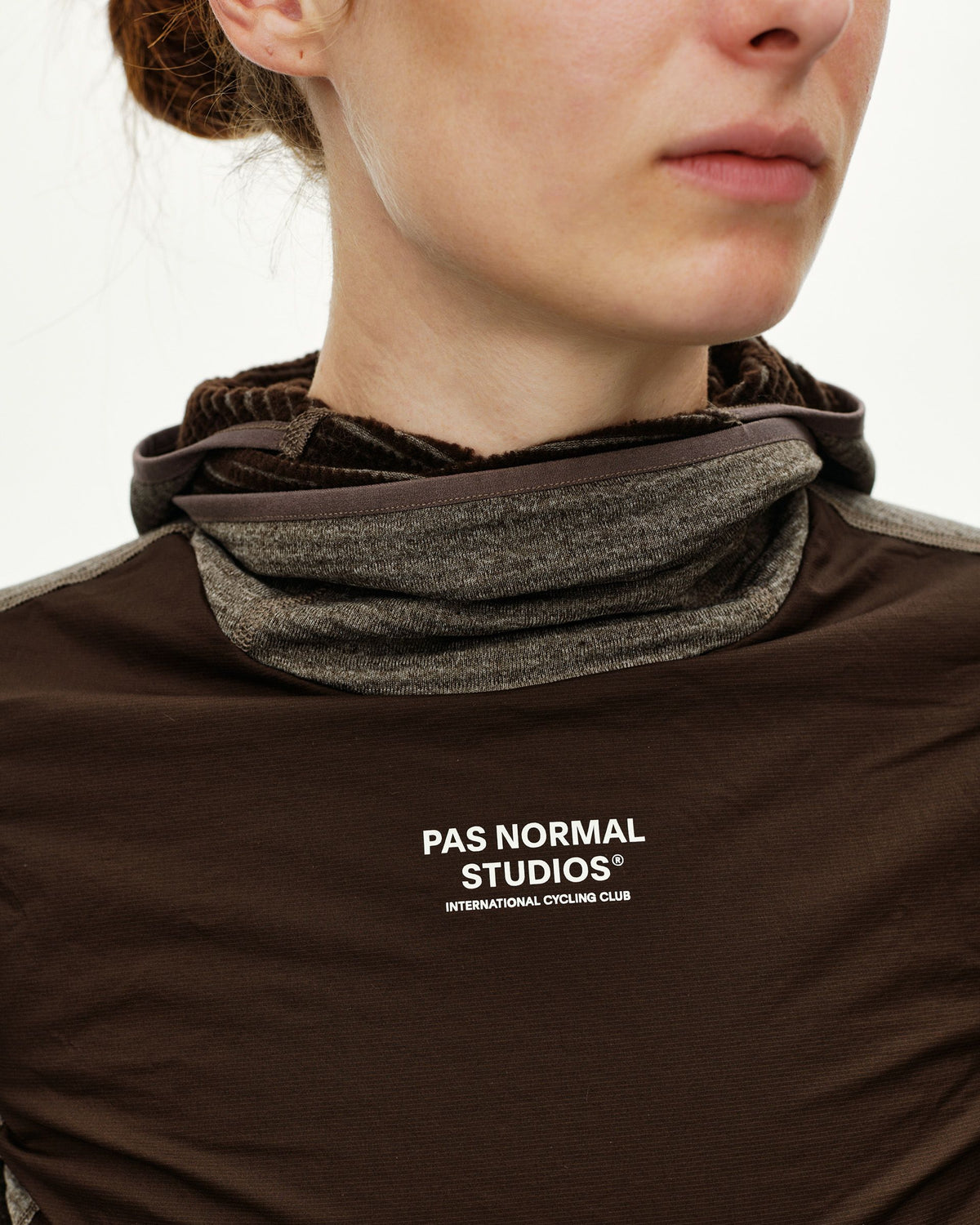 Dark Coffee brown women's thermal hooded windproof cycling base layer, front detail on model with neck gaiter raised #Color_Dark Coffee