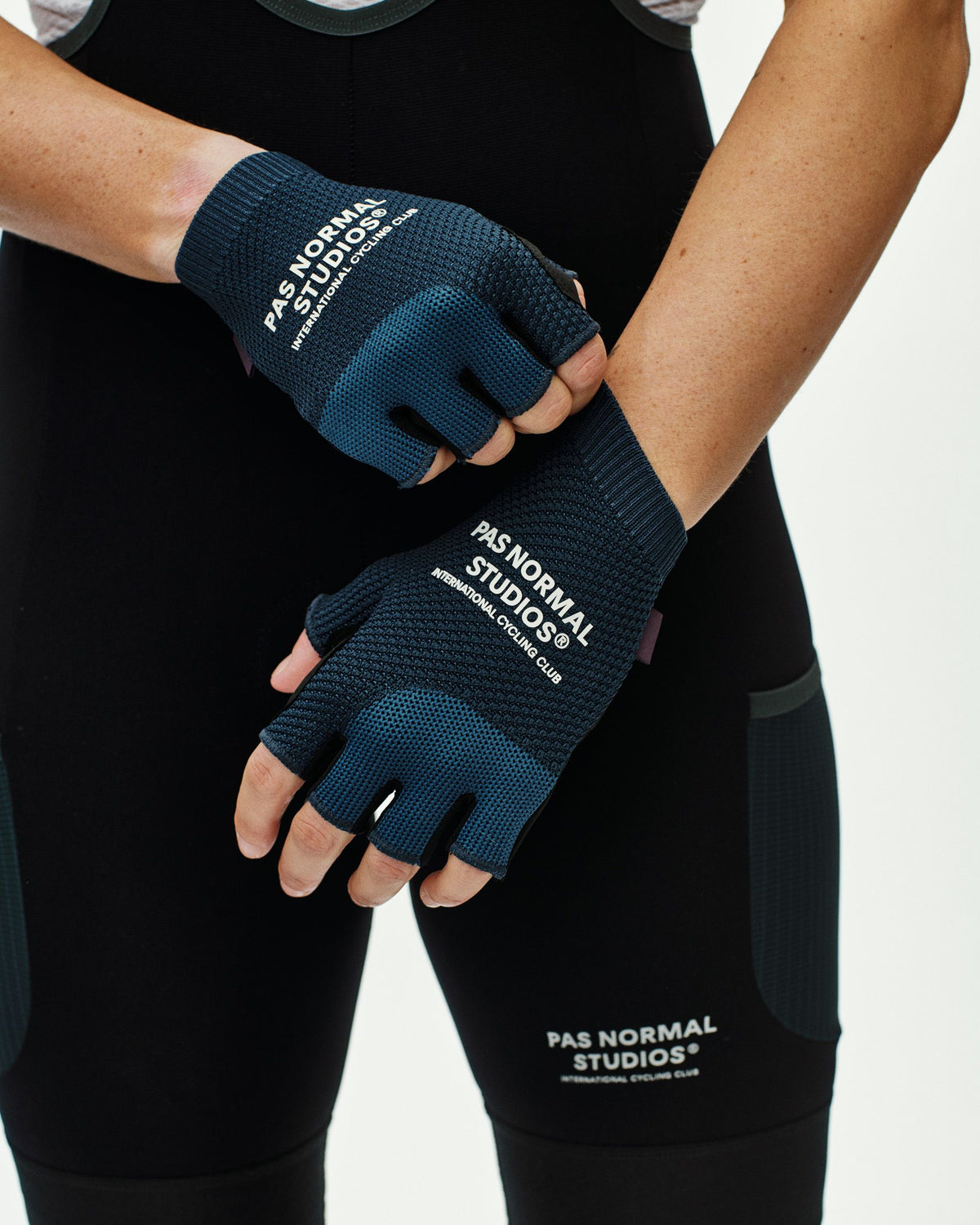 Navy Escapism cycling mitts on model with white logo and textured palm grip #Color_Navy