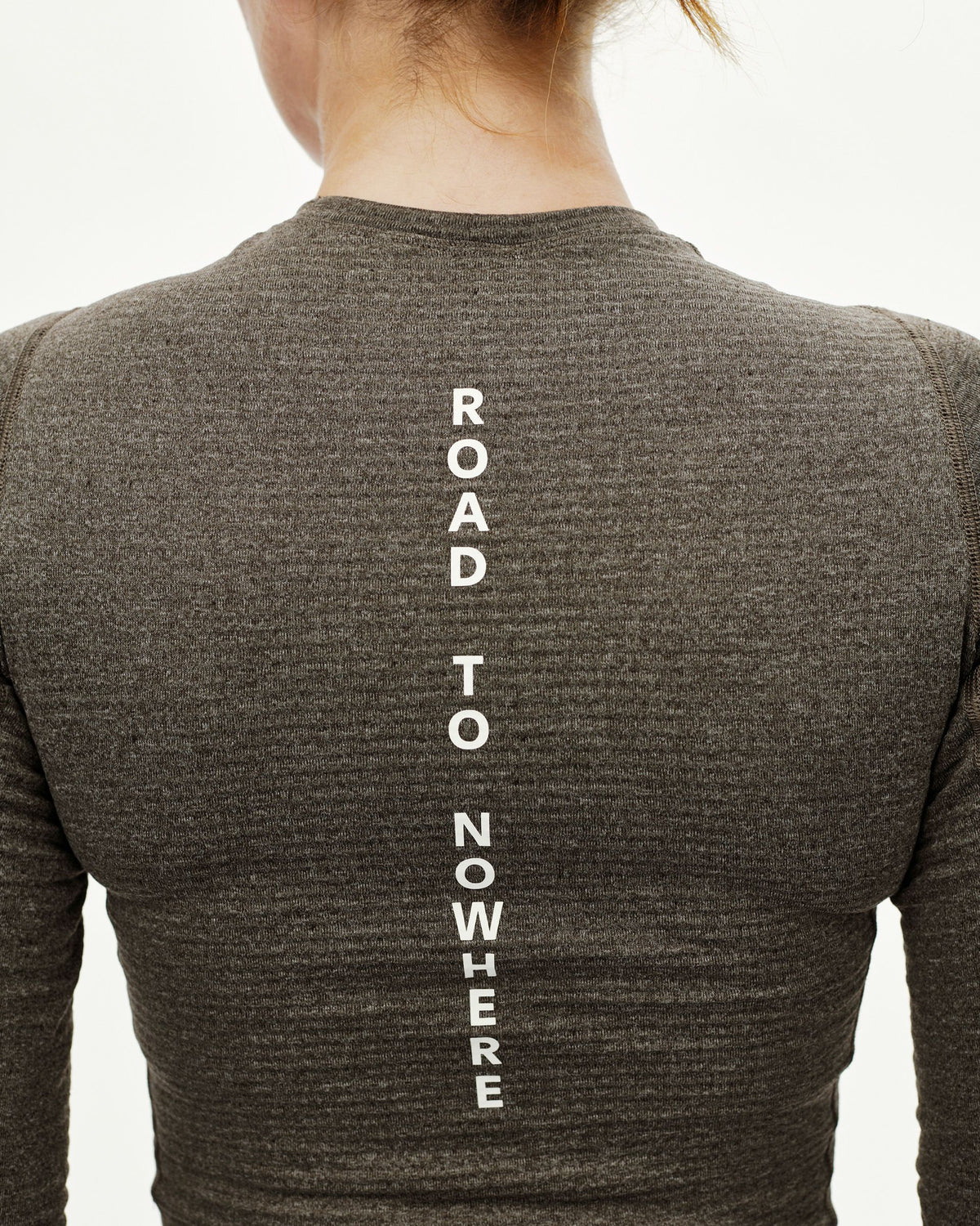 Dark Coffee brown Essential thermal long sleeve baselayer on model, rear view with vertical Road To Nowhere back print #Color_Dark Coffee