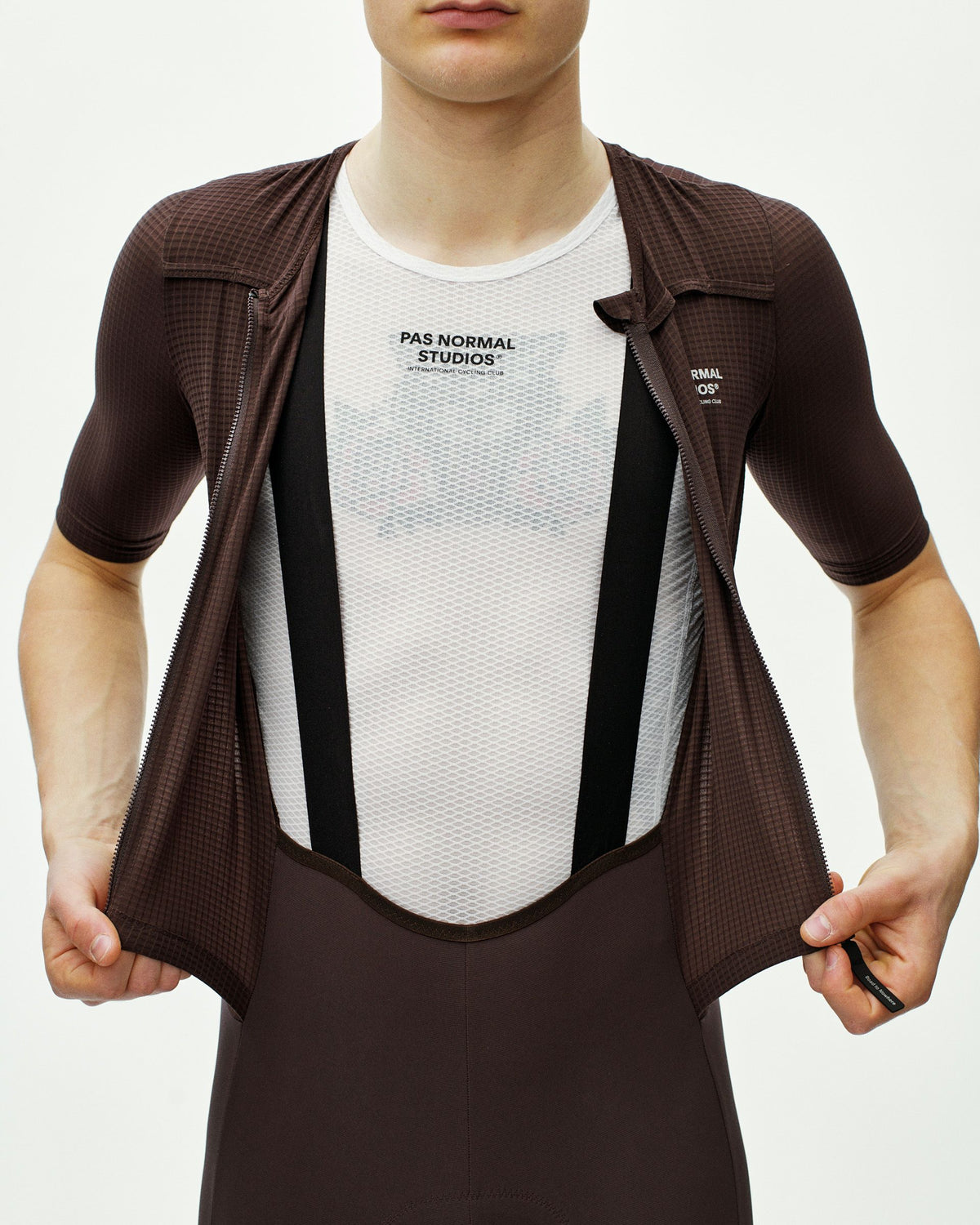 Dark Red Escapism speedsuit on model with mesh chest panel and contrast shoulder straps #Color_Dark Red