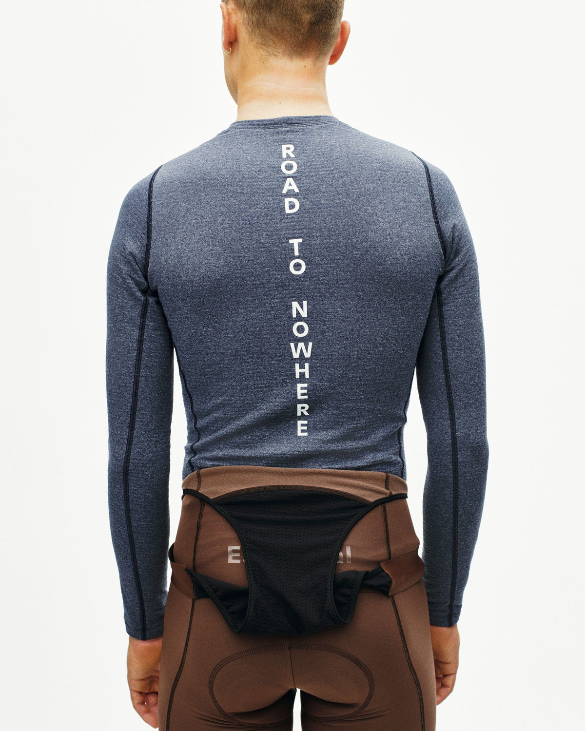 Navy thermal long sleeve base layer on model, rear view with white "ROAD TO NOWHERE" spine text #Color_Navy