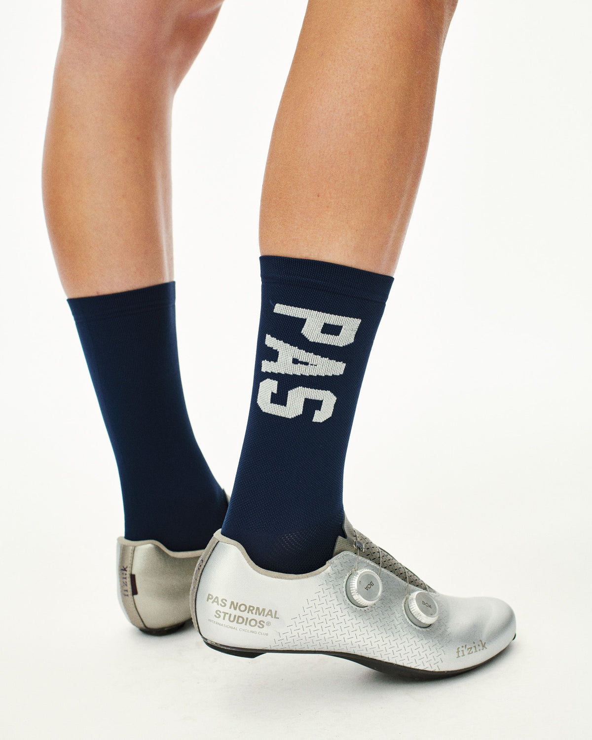 Navy PAS Mechanism cycling socks on model with white logo lettering #Color_Navy