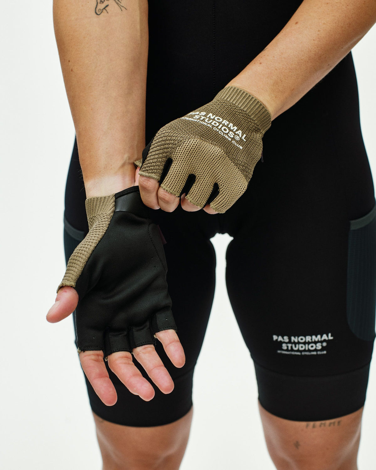 Brown Escapism cycling mitts on model with fingerless design and knit construction #Color_Earth