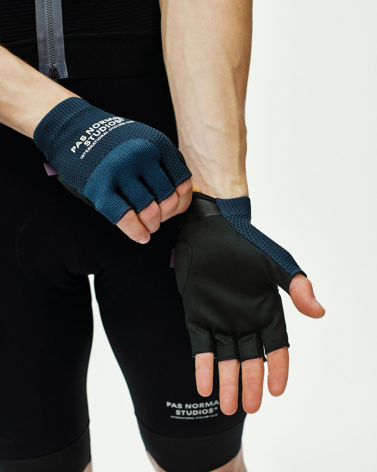 Navy Escapism cycling mitts on model showing fingerless design with textured grip palm #Color_Navy
