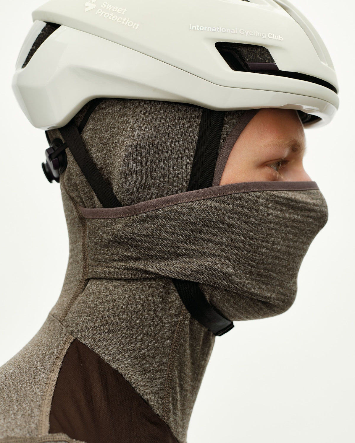 Dark Coffee brown Essential thermal hooded windproof cycling base layer, side view on model worn under helmet with hood up #Color_Dark Coffee